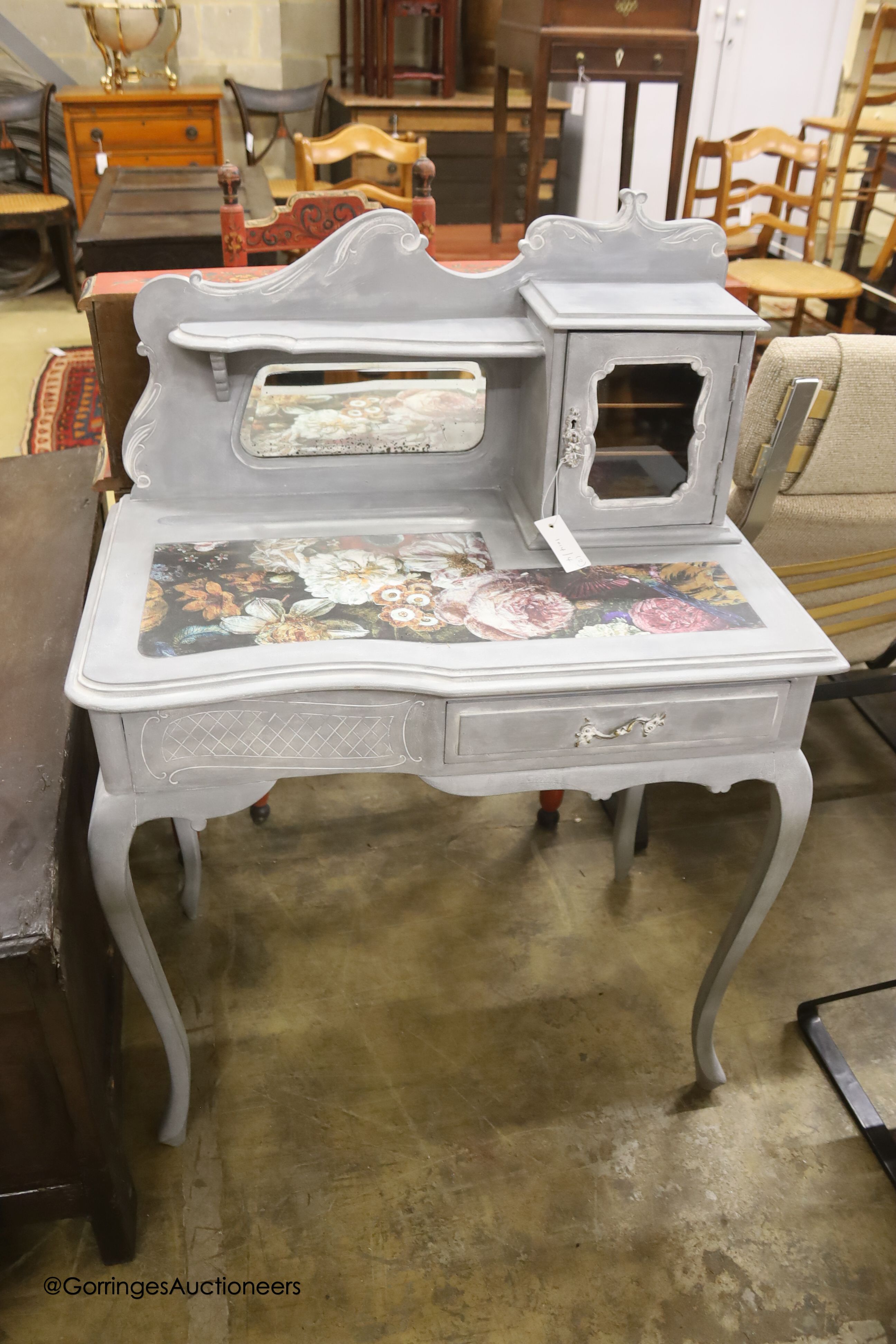 A Victorian later painted dressing table, width 75cm, depth 44cm, height 106cm together with a decoupage wall mirror